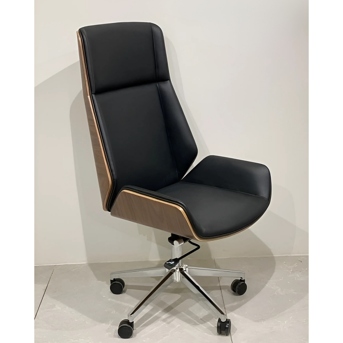 A black office chair with a wooden backrest, black armrests, and a chrome base with wheels.