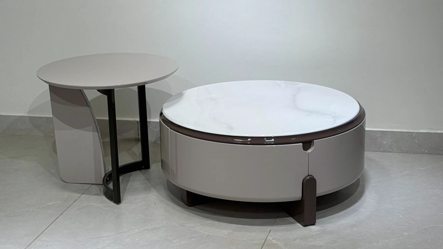 Round marble and taupe modern center table set with sculptural base – luxury furniture for curated interiors