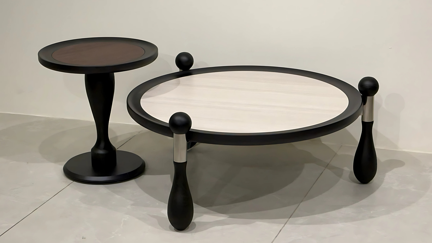 Round cream-top center coffee table with sculptural black orb legs and matching side table – TAS Living