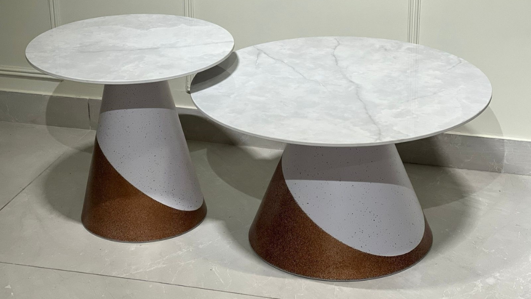 Round white marble center coffee table with terracotta and ivory dual-cone base design