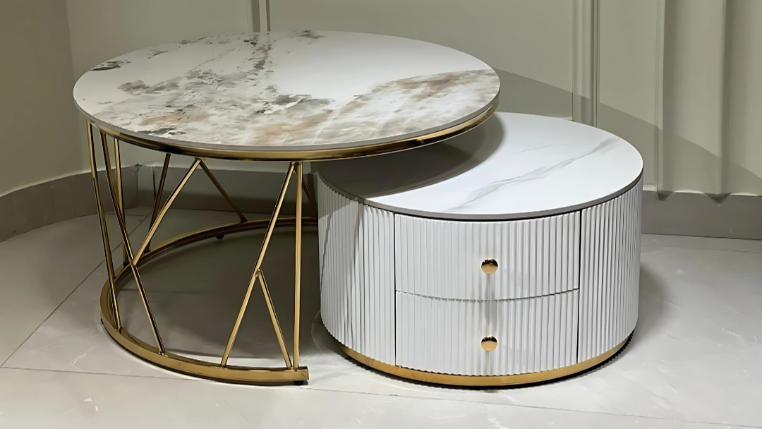 Round marble center coffee table set with gold metal base and modern layered design.