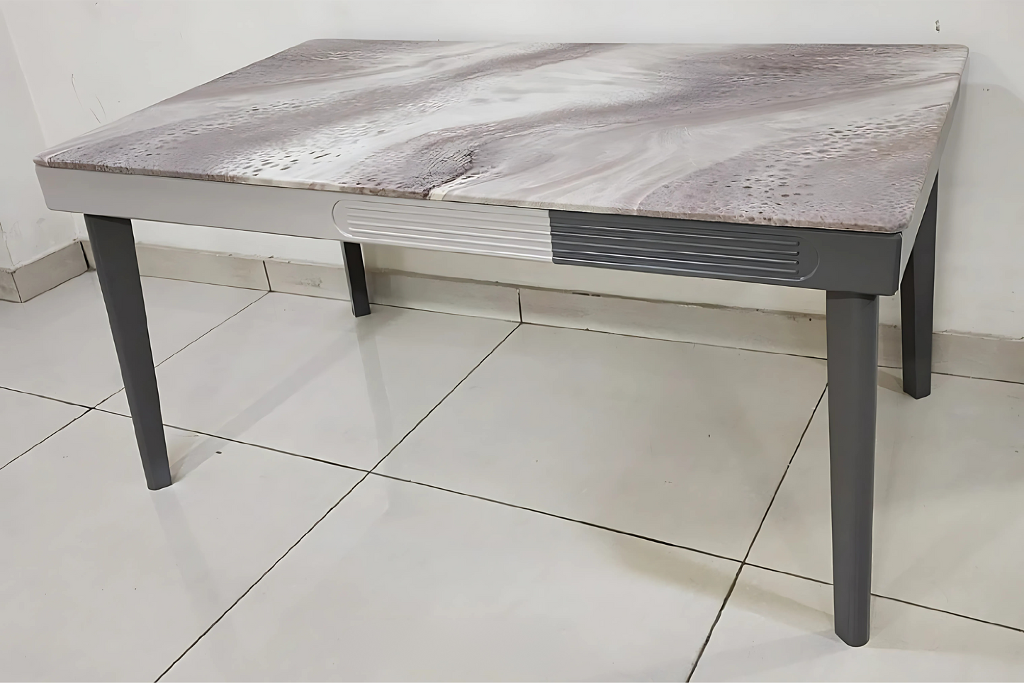 Modern grey dining table with abstract wave-textured top and graphite legs for luxury interiors
