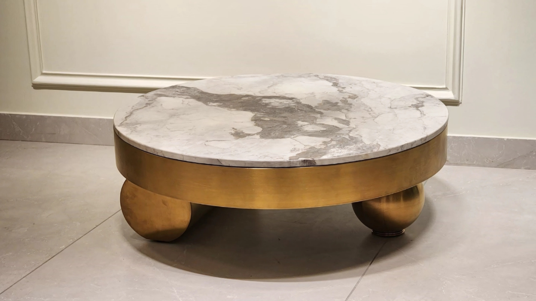 Round marble center coffee table with antique gold spherical legs and luxury sculptural base