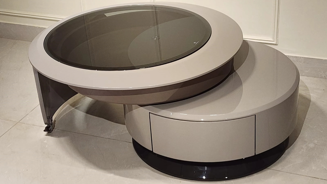 Modern circular center coffee table with smoked glass top and grey glossy dual-tier design
