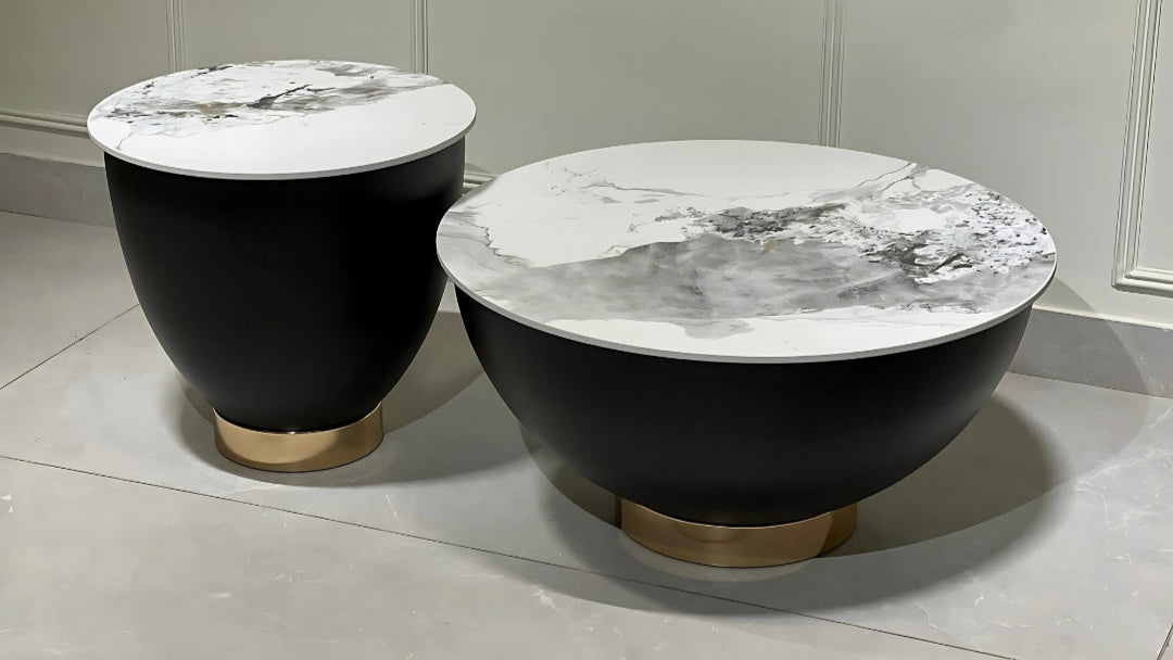 Luxury black and white marble duo center coffee tables with round sculptural bases and gold accents