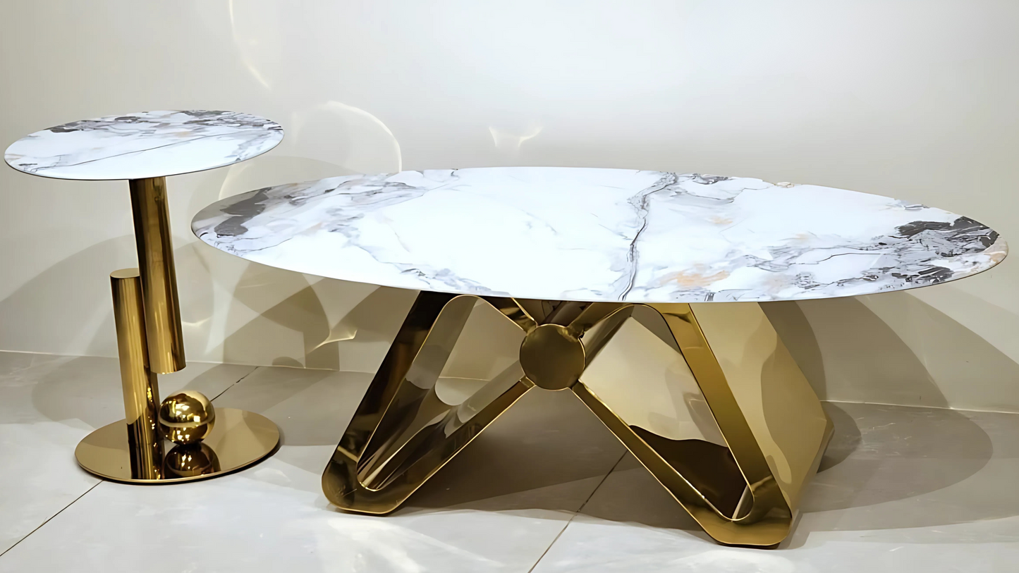 "Sculptural gold center coffee table with marble top and orb base by TAS Living