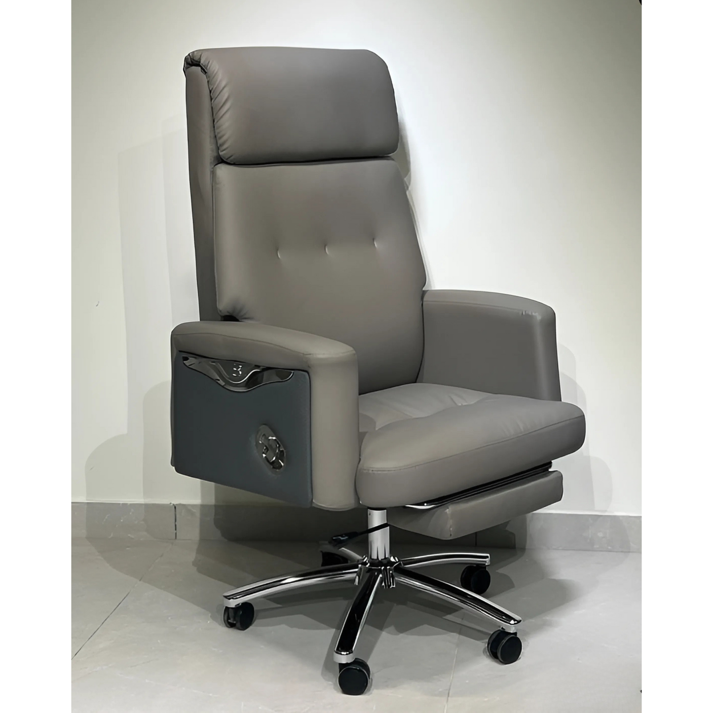 A gray executive office chair with a high back, armrests, and a five-point wheeled base.