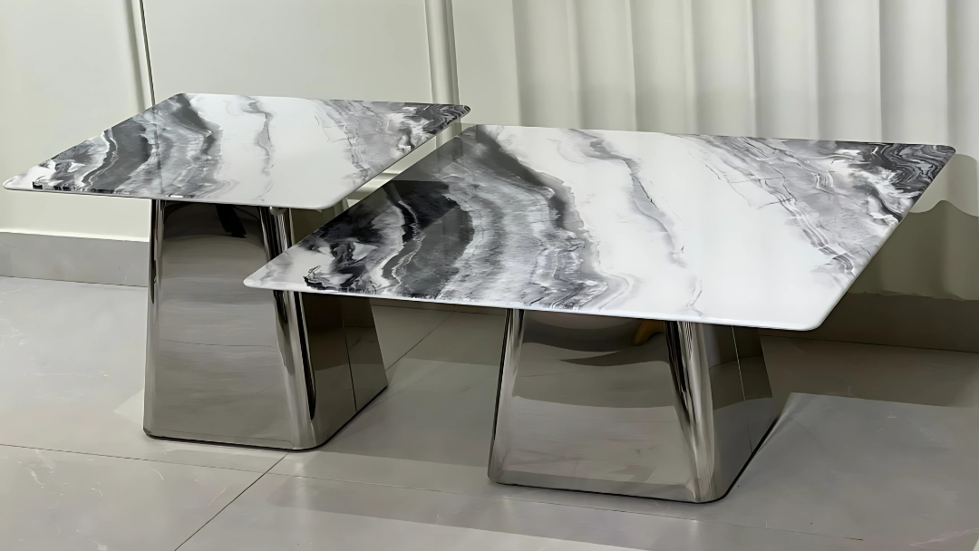 Modern rectangular marble center coffee table set with veined black tops and reflective steel bases