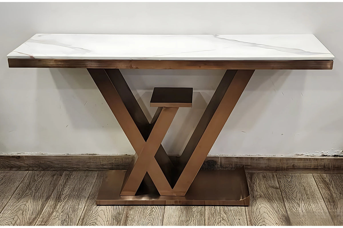 A black marble console table with gold looped legs and a wooden base.