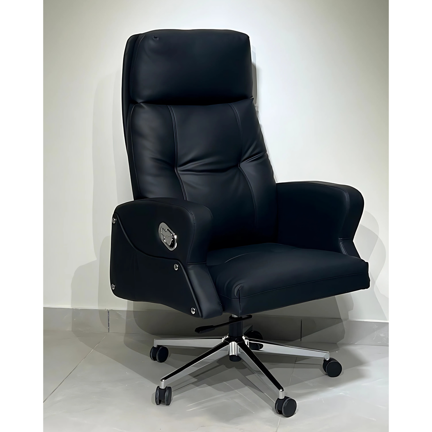 A black leather office chair with a high back, footrest, and adjustable armrests, mounted on a five-point wheeled base.