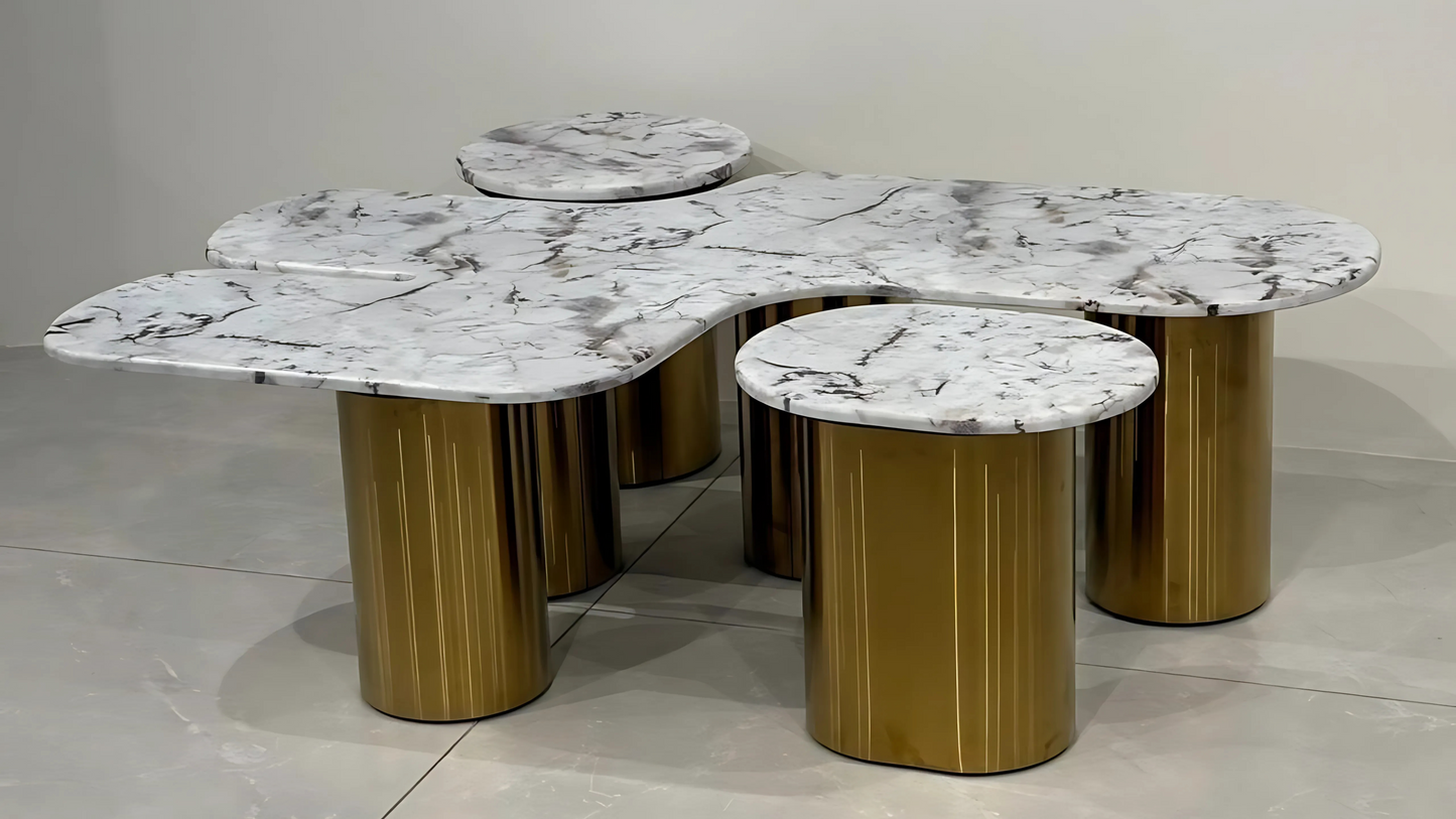 Luxury center table set with abstract white marble tops and gold cylindrical bases