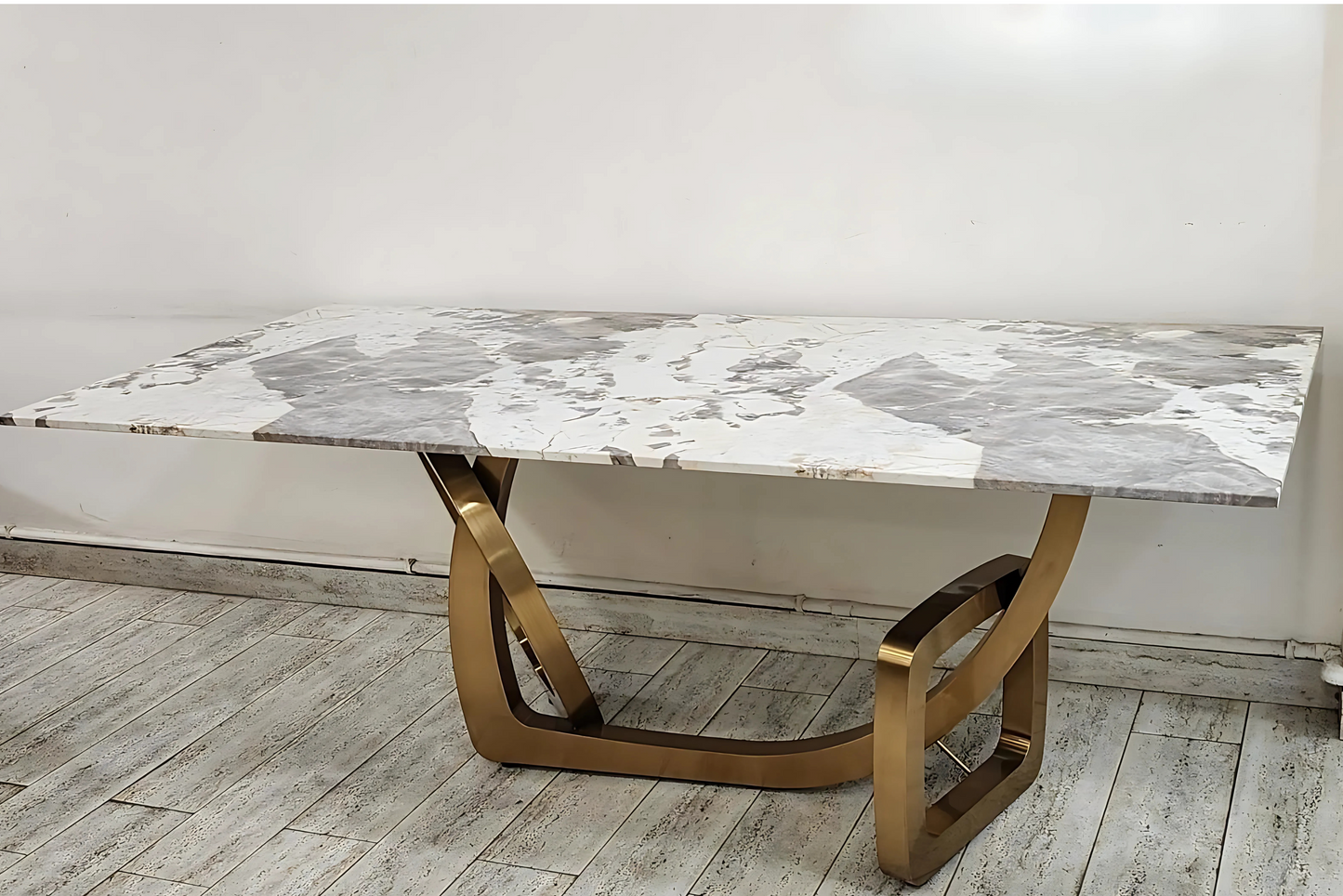 Beige marble-inspired dining table with wave-textured top and taupe designer chairs — a serene luxury for refined interiors.