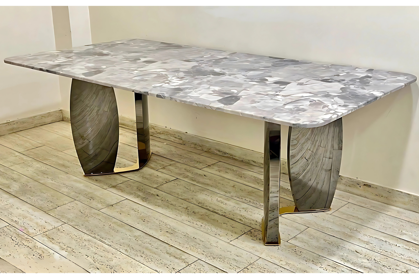 Luxury marble dining table with silver sculptural base and abstract grey veining