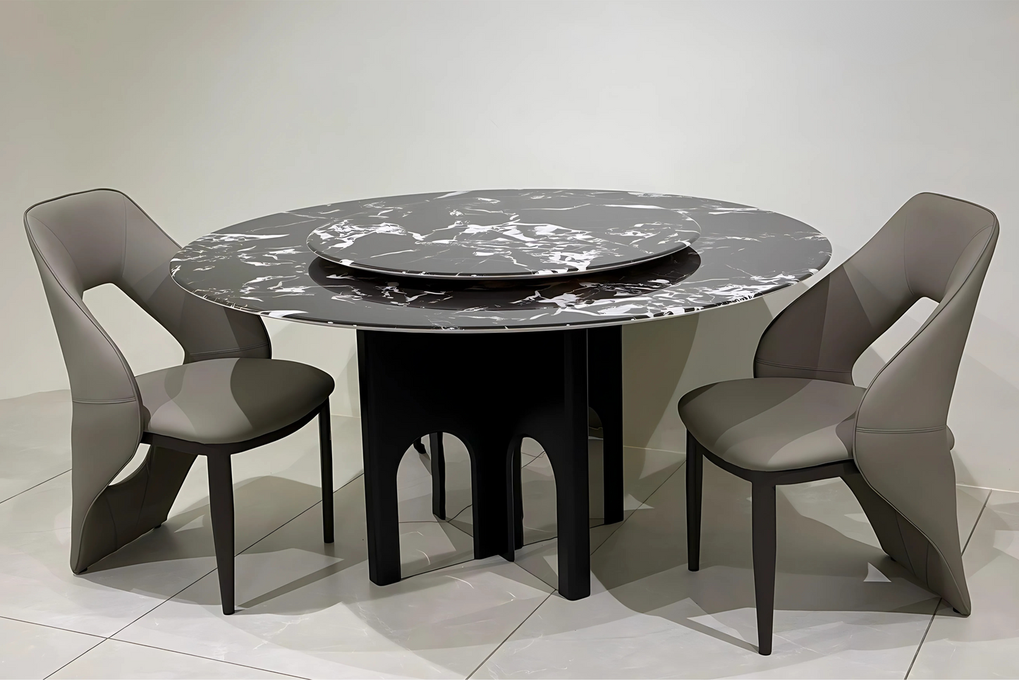 Round black marble dining table with Lazy Susan and sculptural arched base