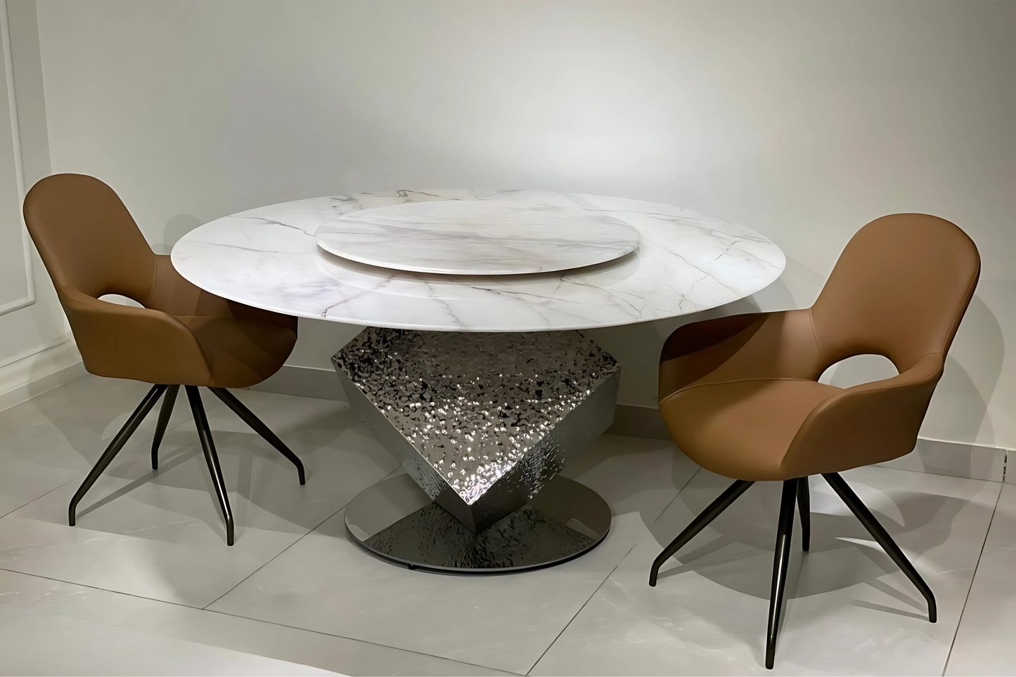 Luxury marble dining table with diamond-cut metal base and caramel designer chairs by TAS Living