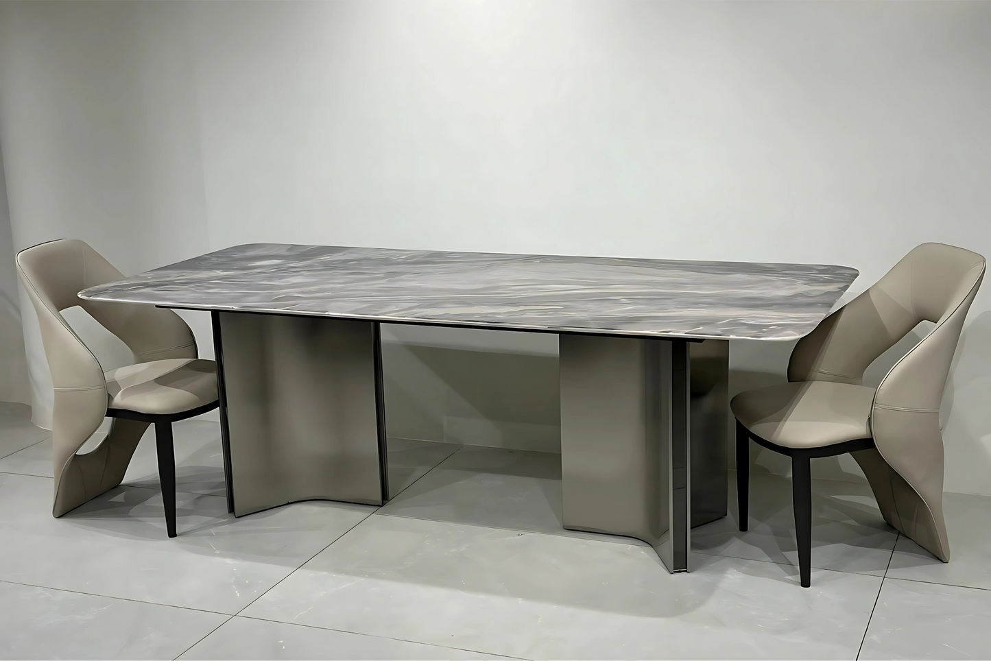 Marble dining table with wave-shaped pedestal base and taupe sculpted dining chairs in luxury modern style.