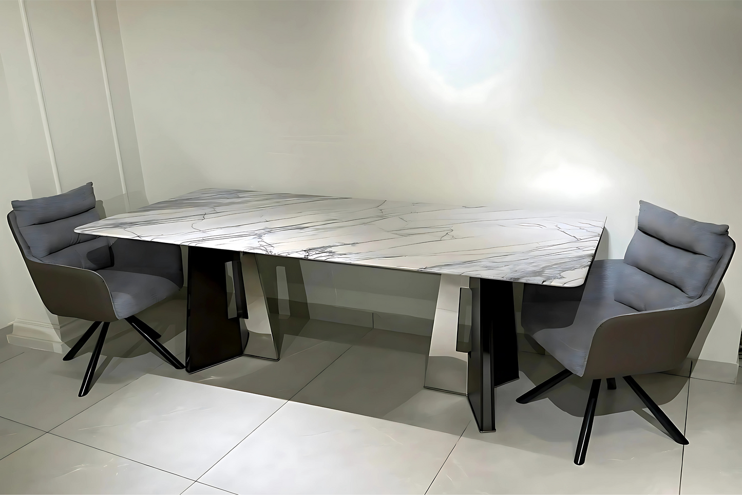 Marble dining table with metal pedestal base and grey taupe swivel chairs in luxury modern style.
