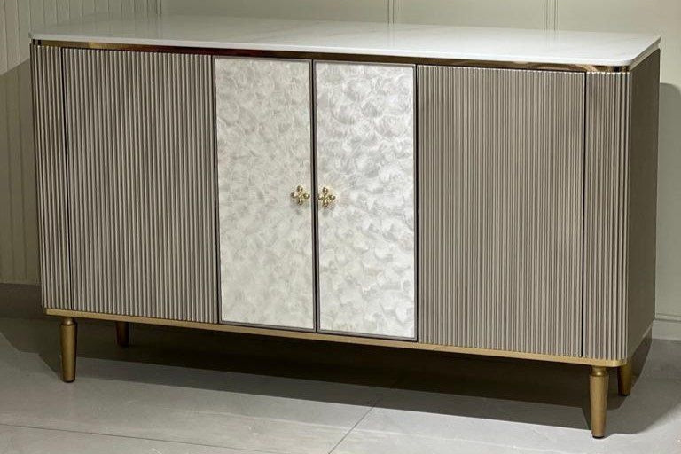 Modern sideboard with marble patterned doors on a neutral background
