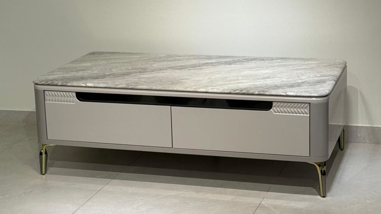 Luxury marble coffee table with storage drawers and golden metal legs for modern interiors