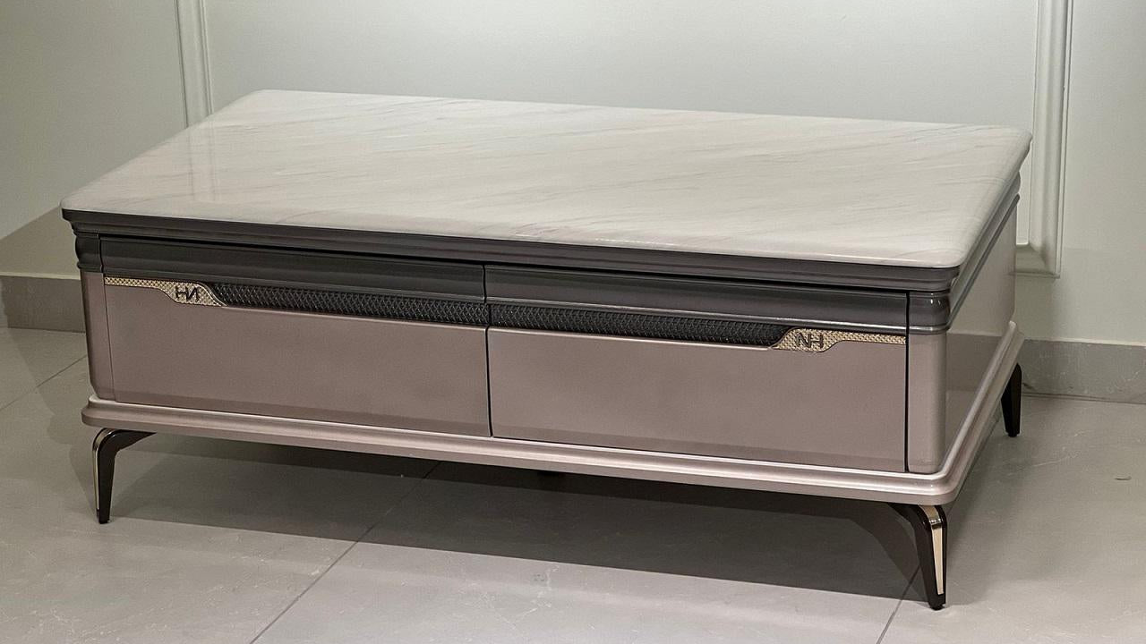 Luxury marble center coffee table with taupe body, storage drawer, and metallic inlay on black legs
