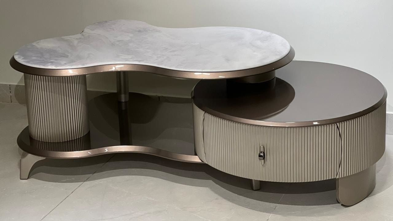 Organic white marble coffee table with champagne-toned base and fluted detailing — TAS Living