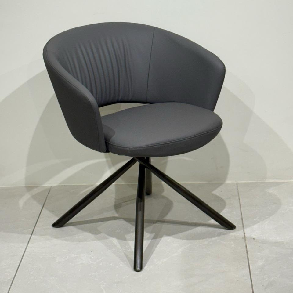 Modern curved-back chair in grey leatherette
