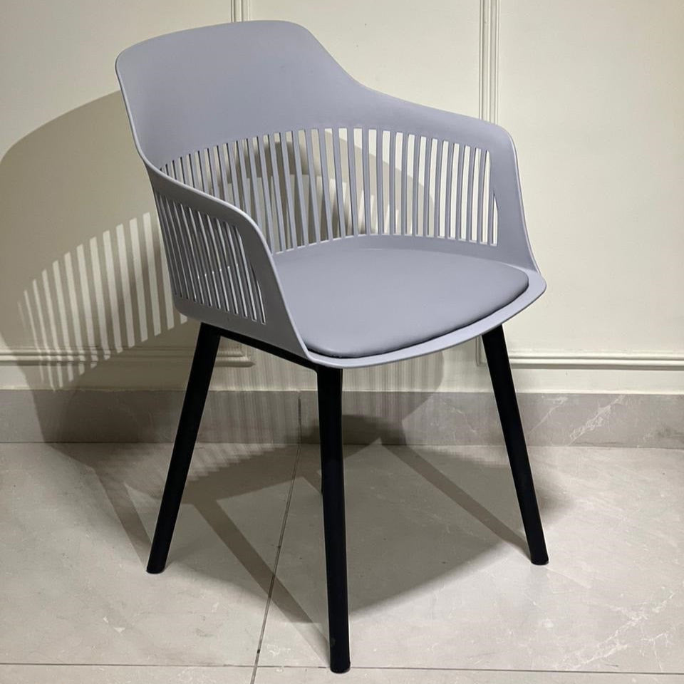 Grey modern armchair with sculpted back and black legs