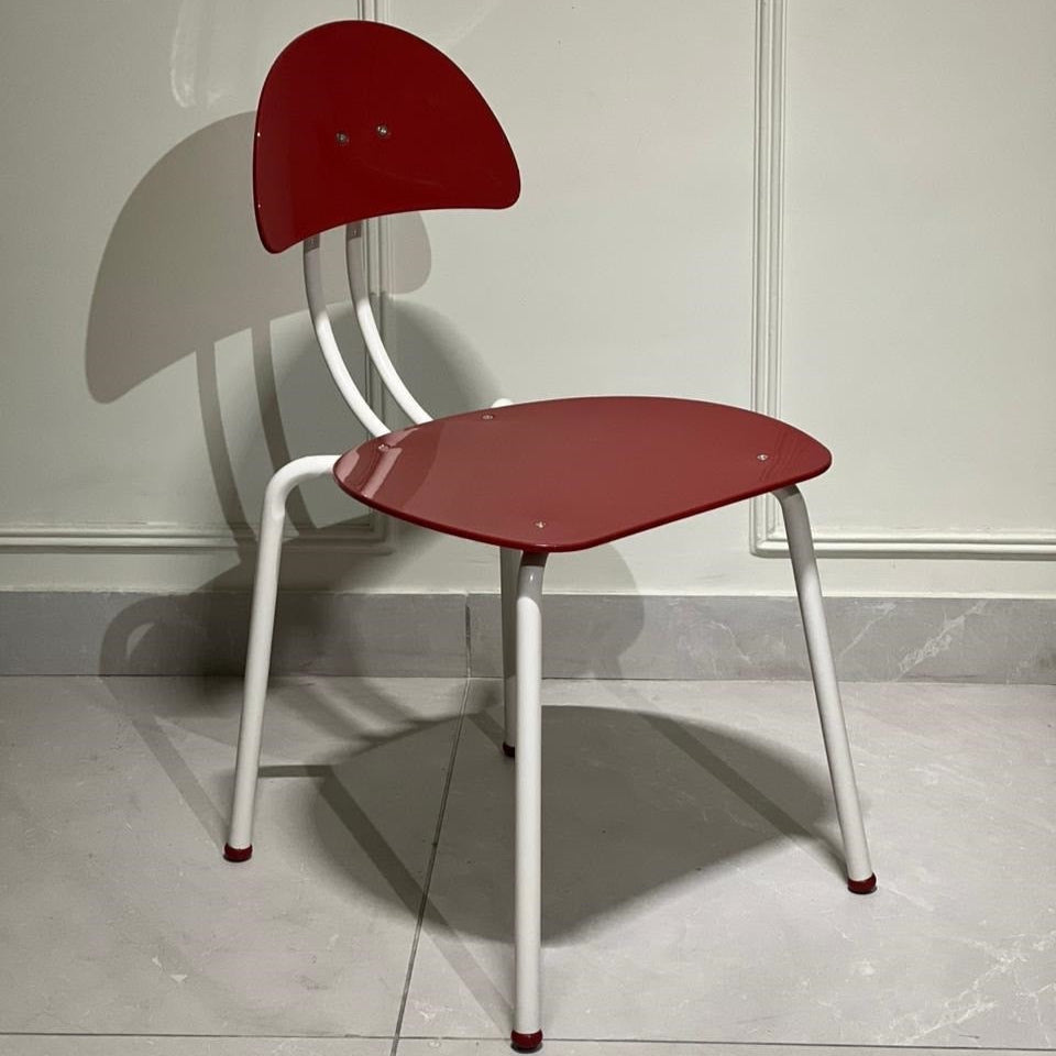Red and white modern accent chair with curved back