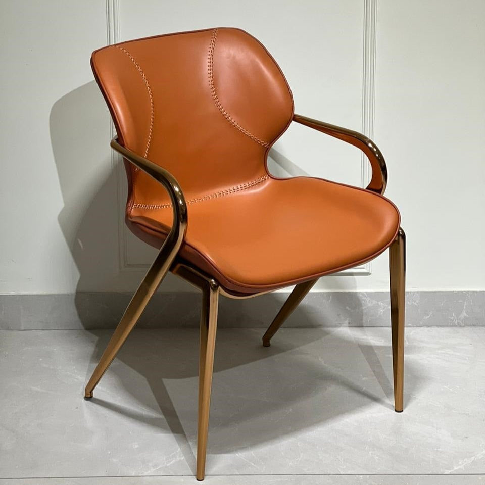 Orange leatherette luxury chair with golden legs