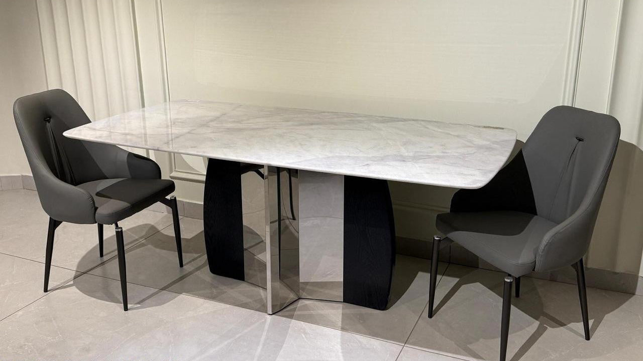 Dining table set with chairs in a room setting
