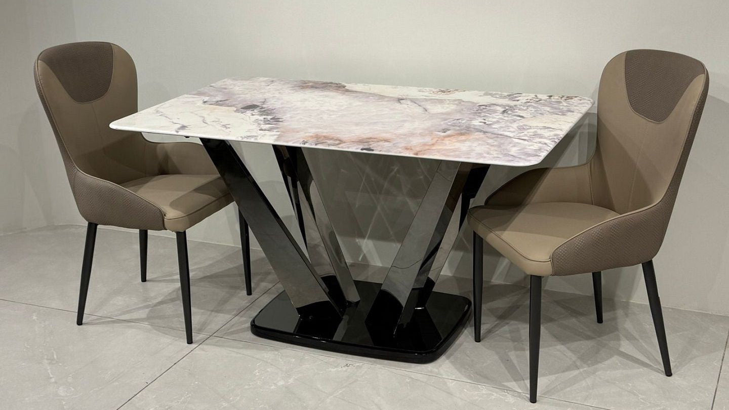 Dining table set with marble-patterned table and gray chairs on a light gray floor.