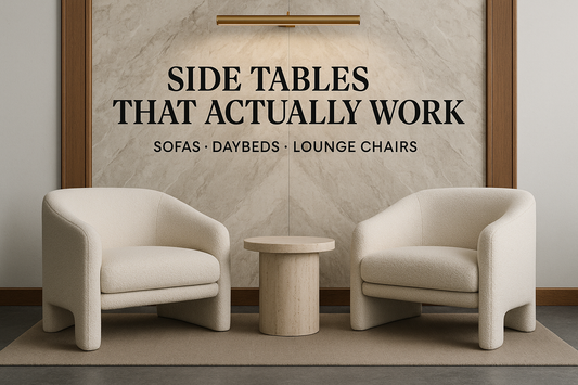 Lounge Pair — basalt floor, marble panel, brass picture light (crisp)  On-image text (exact): SIDE TABLES THAT ACTUALLY WORK SOFAS · DAYBEDS · LOUNGE CHAIRS