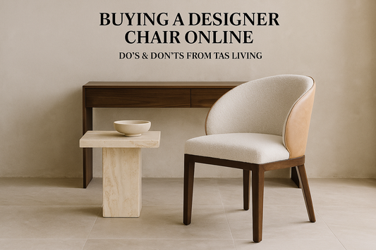 Luxurious modern living room — accent chair in beside travertine side table and walnut console. 