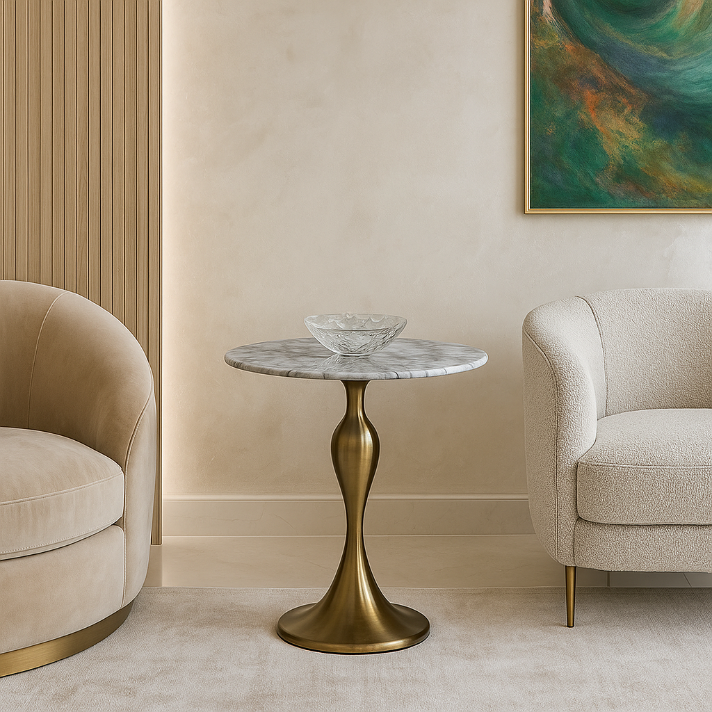 Decorative side table with marble top and gold base in a stylish room with beige walls and furniture.