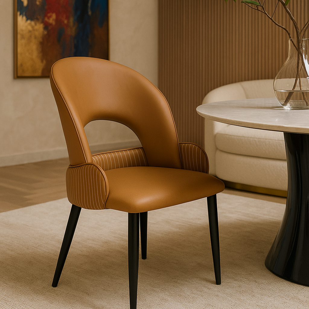 Brown leather chair in a room with a table and abstract painting