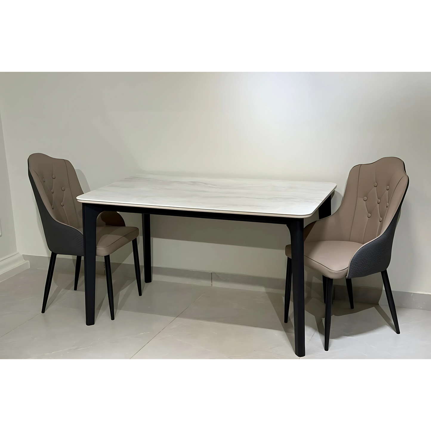 A rectangular dining table with a white marble tabletop and black metal legs, accompanied by two upholstered chairs.