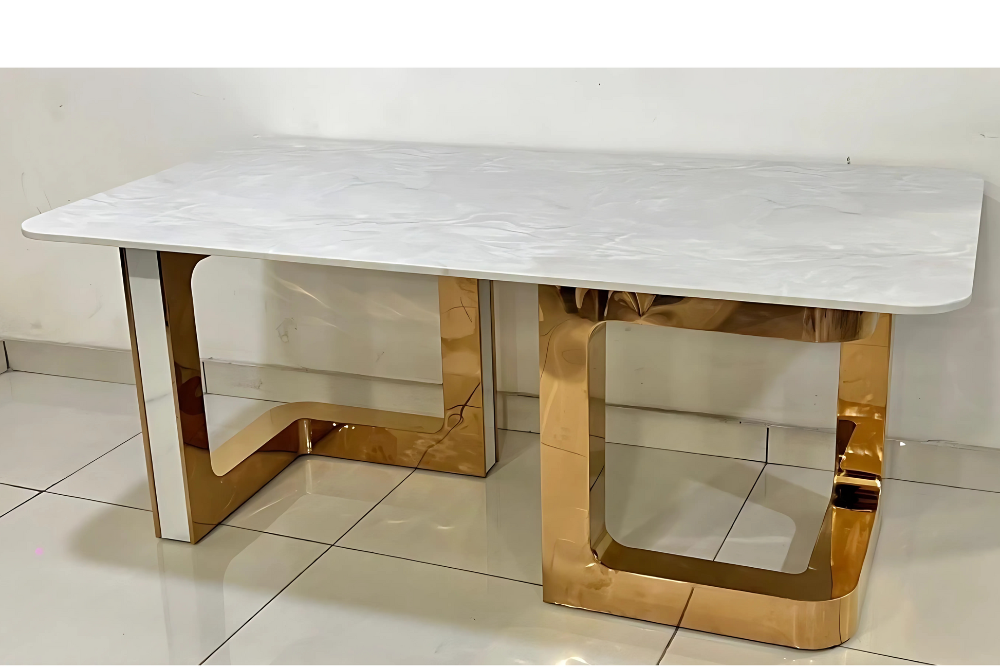 Luxury white marble dining table with sculptural rose gold open-frame metal legs