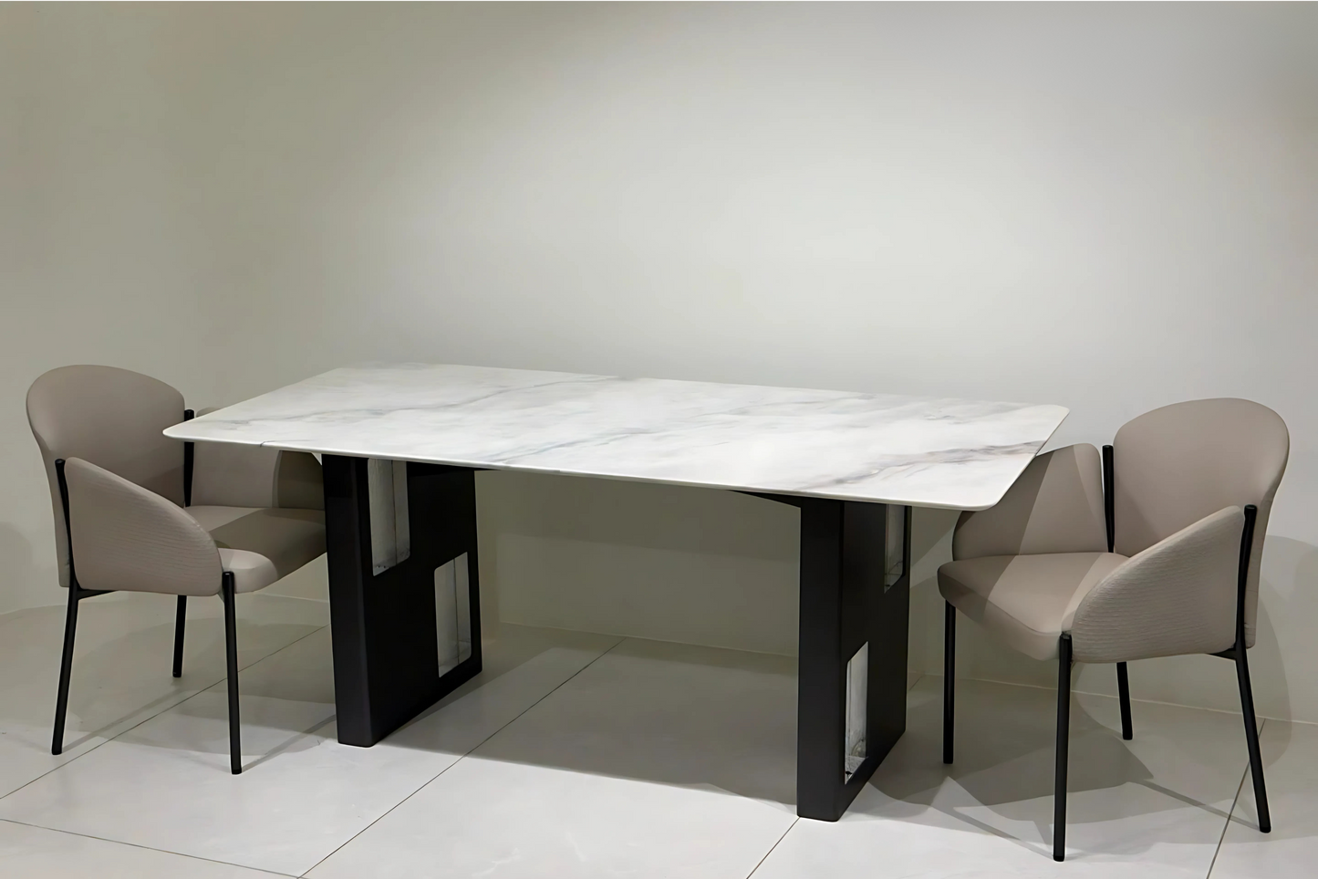 Modern black-leg dining table with white marble top and chrome detailing
