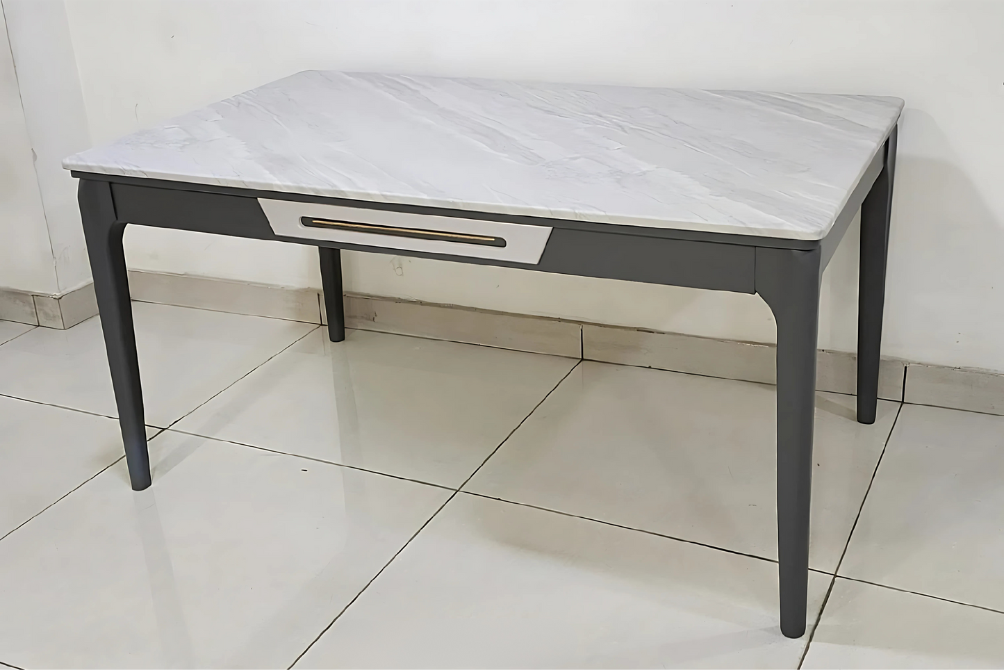 Modern white marble dining table with grey legs and center drawer accent