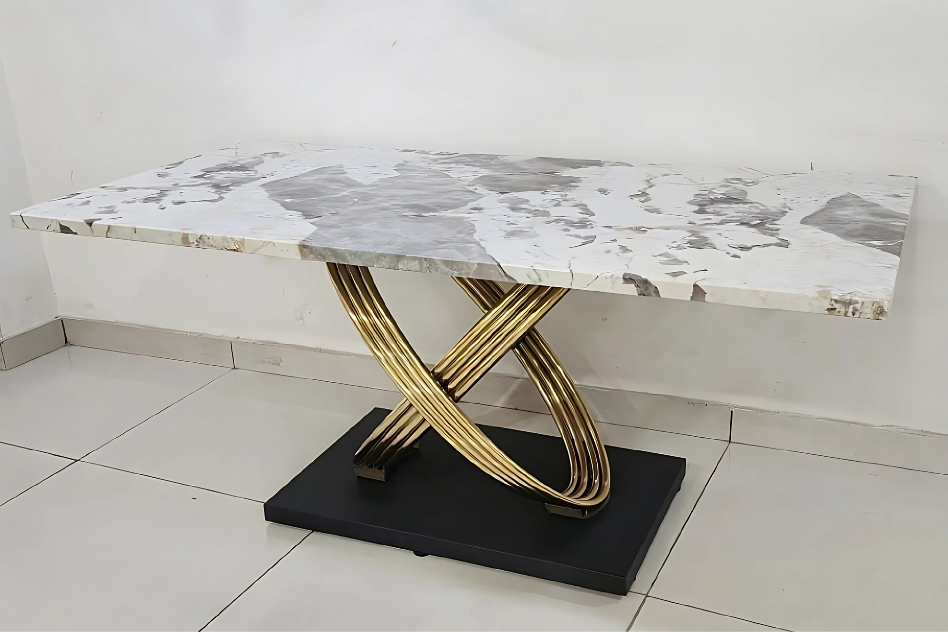 Luxury marble dining table with golden sculptural loop base and black platform foundation