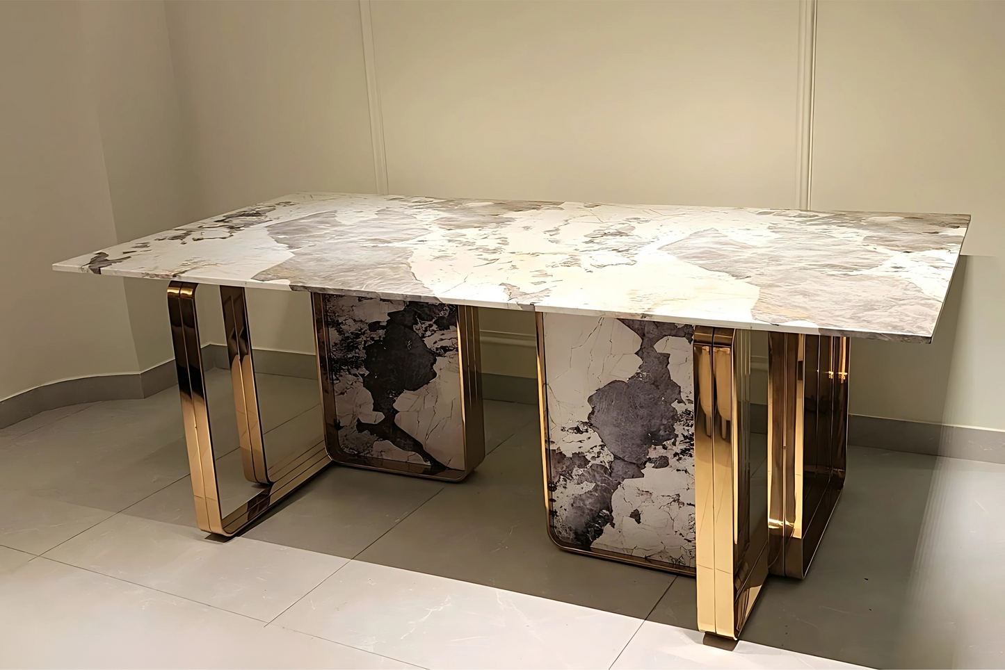 Orion Eclipse luxury marble dining table with gold pedestal base and bold stone veining