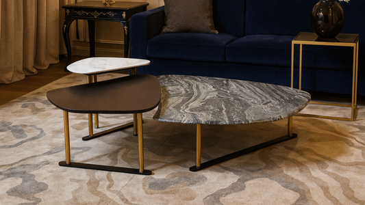 Three-piece center table with grey marble, ivory top, and charcoal wood finish
