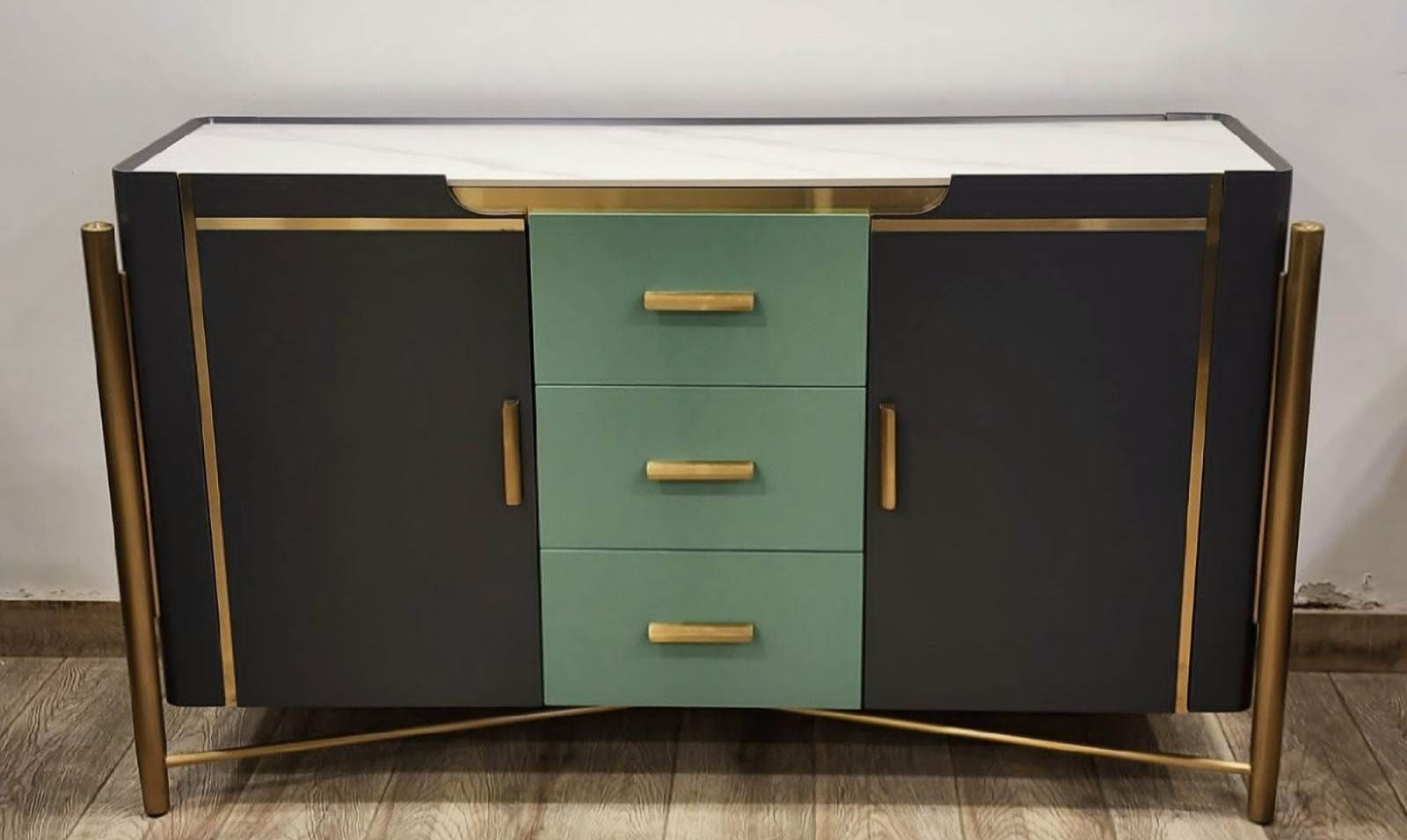 Modern sideboard with black and green design on a wooden floor.