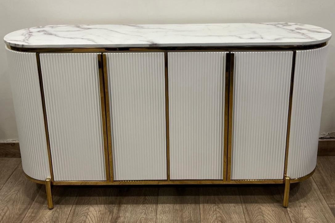 White marble-top console table with gold accents on a wooden floor.