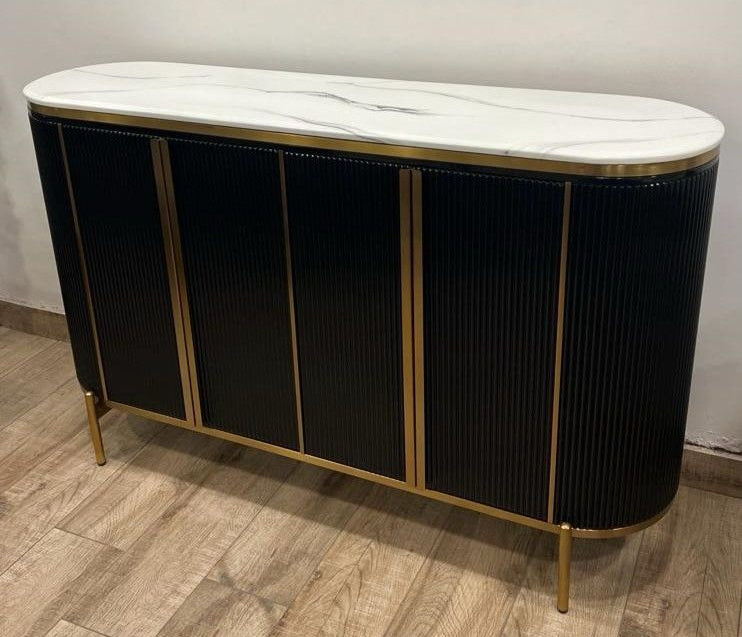 Black sideboard with marble top on a wooden floor