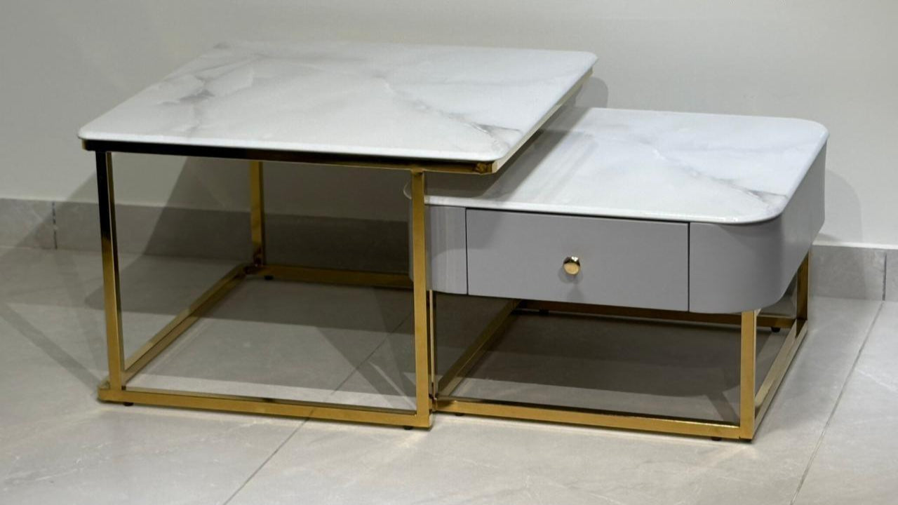 White marble coffee tables with geometric gold base design — TAS Living