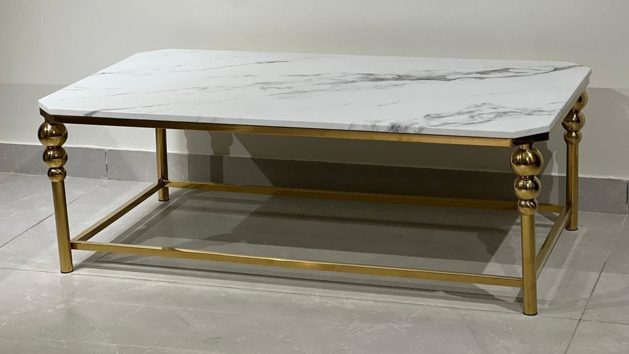 Rectangular white marble coffee table with golden frame and sphere-detailed legs — TAS Living