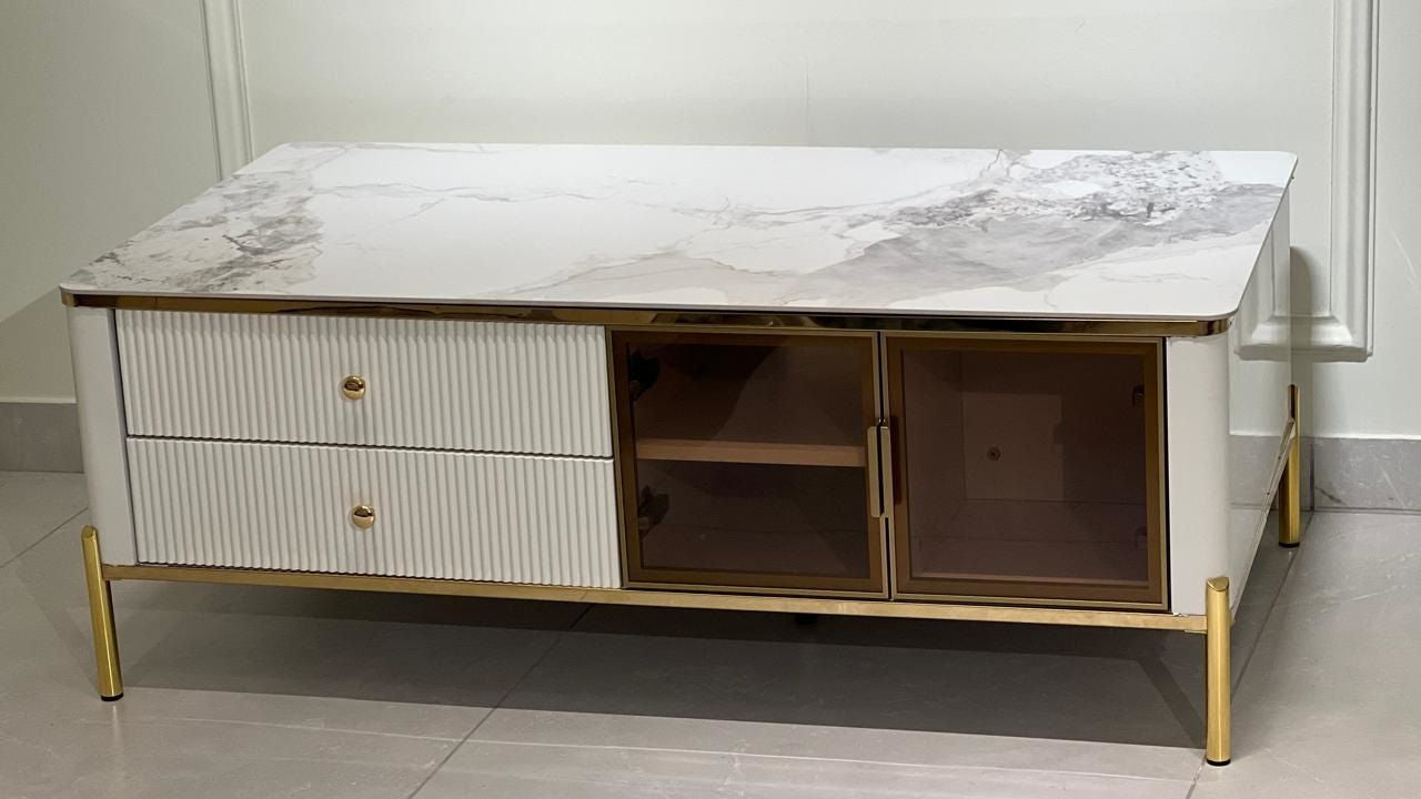 White marble and gold luxury center coffee table with fluted drawers and glass-fronted storage — TAS Living