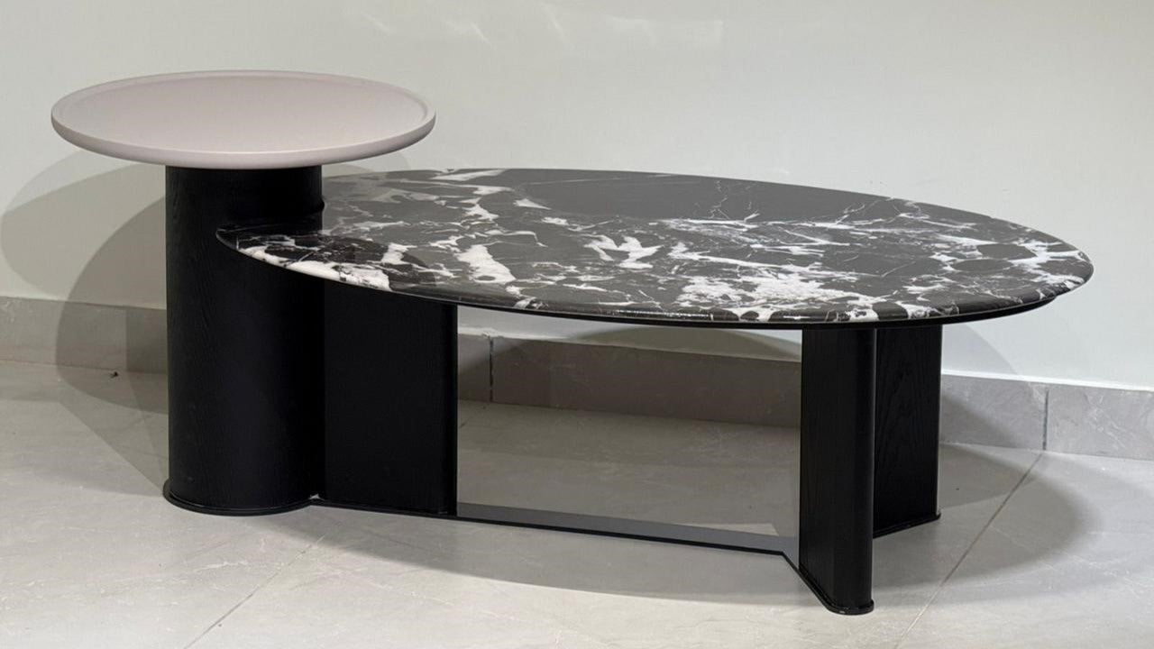 Luxury dual-tone marble center table with black oval top and beige accent table