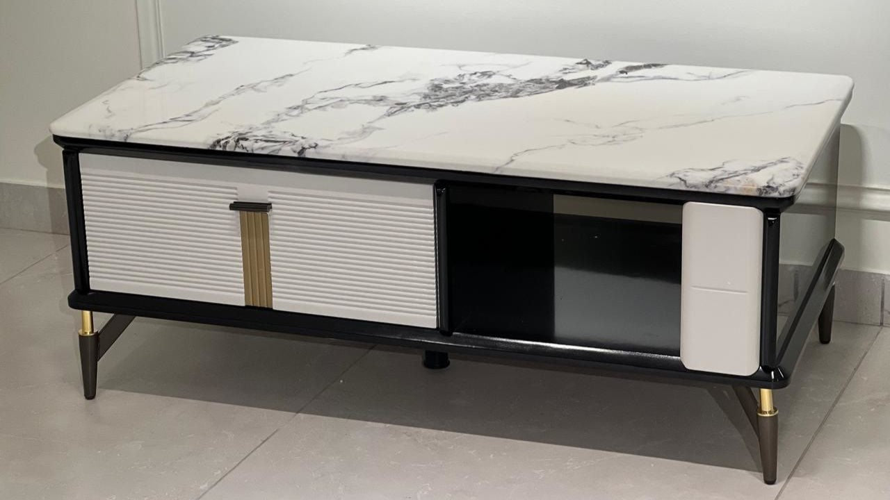 Modern black and white marble top center table with fluted drawer and gold accents

